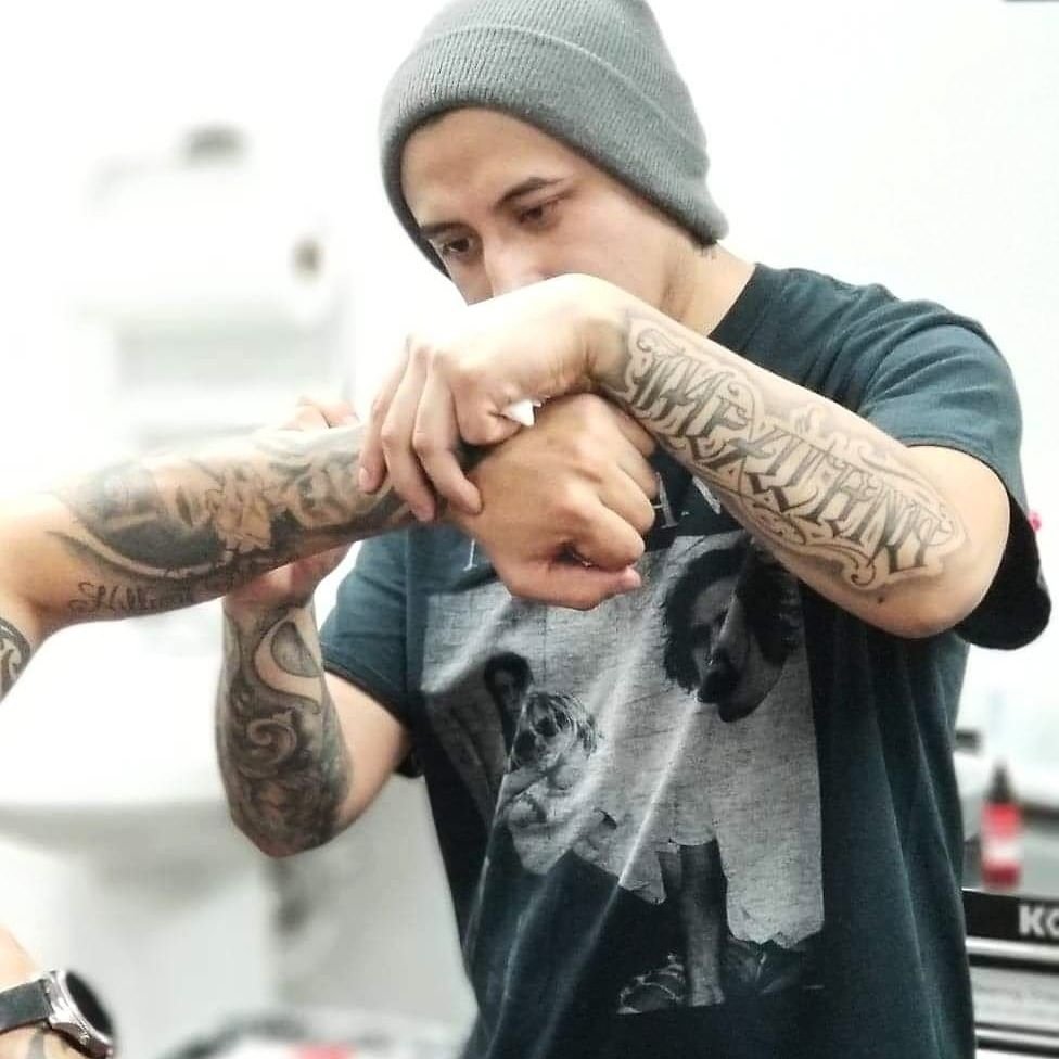 Alejandro Campos tattooing at Solace Art Collective in Indianapolis